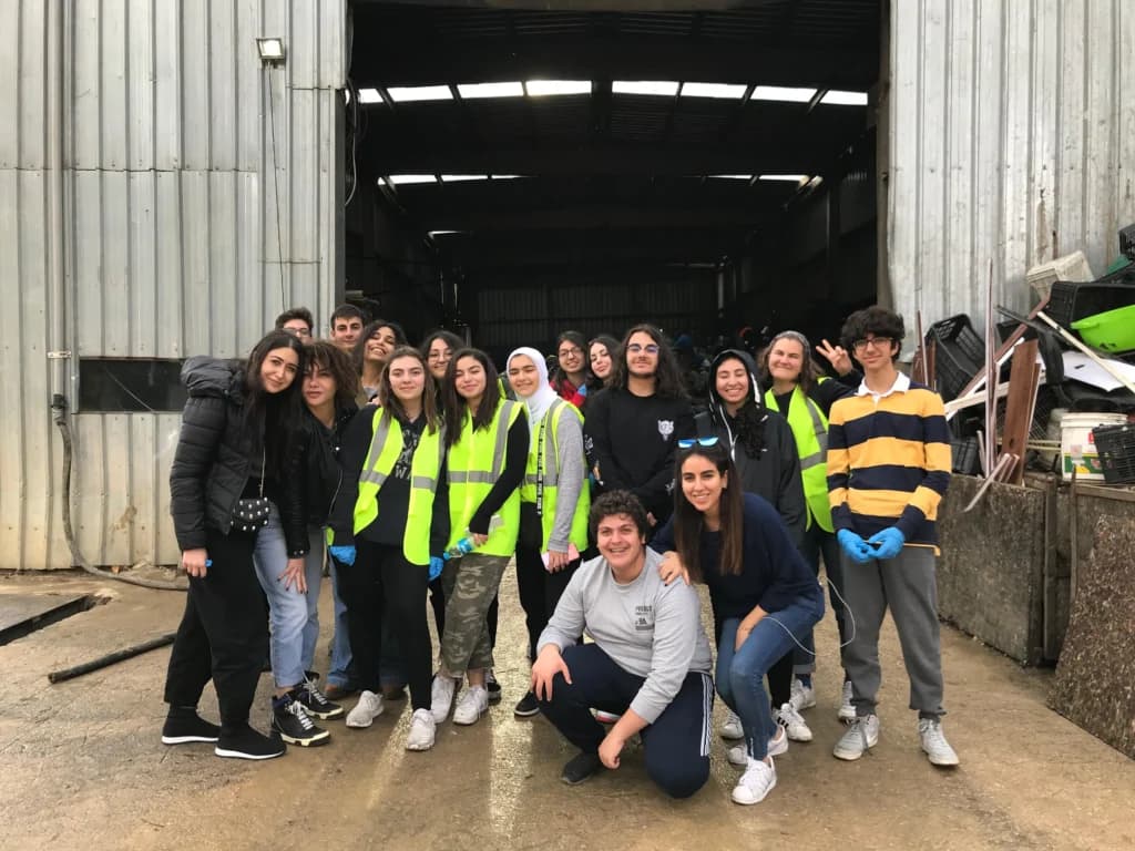 Student volunteers at a composting facility